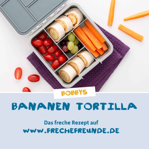 Rezept: Leckere Snackbox mit dem Rezept „Bobbys Bananen-Tortilla“ aus der frechen Freche-Freunde-Welt. Neben Mini-Tortillas mit Banane auch Karottensticks, Weintrauben und Kirschtomaten