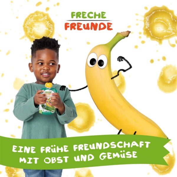 Ein Kind isst einen Freche Freunde Quetschie, daneben steht Bob Banane mit Kulleraugen und starken Armen vor gelbem Mus-Kleckshintergrund. Slogan: „Eine frühe Freundschaft mit Obst und Gemüse“.