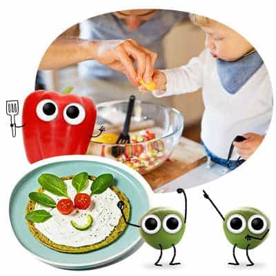 Kind und Papa mixen einen Salat. Freches Gemüse freut sich beim Spinatpfannkuchen-Gesicht - kochen mit Kindern Rezepte.